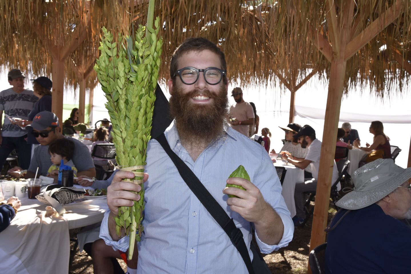 Rabbi Yossi Rodal with the Sukkot Lulav and Etrog, one of the main symbols of the holiday
