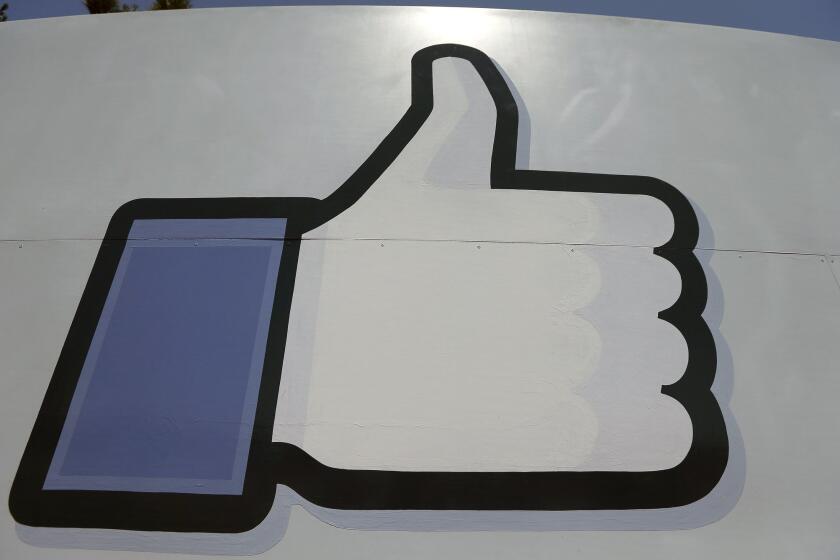 Instead of merely directing users to news sites, Facebook may start hosting publishers' articles itself. Above, Facebook's "like" symbol at the entrance to the company's Menlo Park campus.