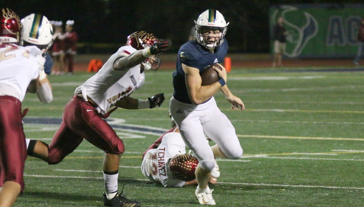 Maverick QB Marshall Eucker looks for running room.