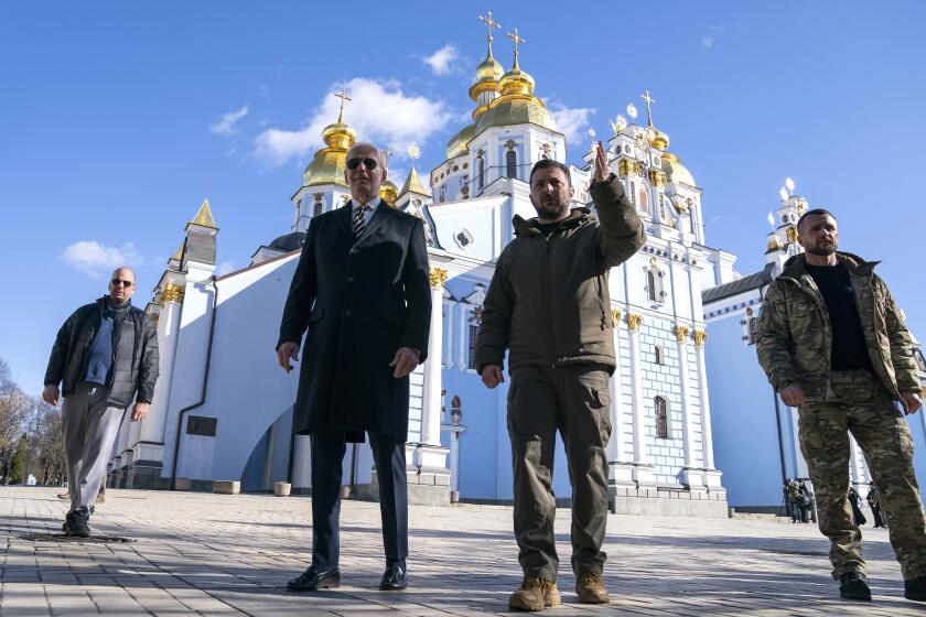 President Joe Biden walks with Ukrainian President Volodymyr Zelenskyy at St. Michaels Golden-Domed Cathedral on a surprise visit, Monday, Feb. 20, 2023, in Kyiv. (AP Photo/ Evan Vucci)