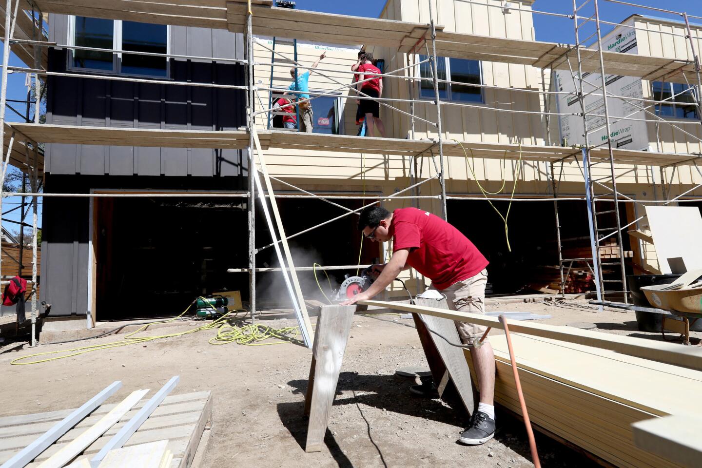 Photo Gallery: Bank of America employees volunteer at Habitat for Humanity homes in Glendale