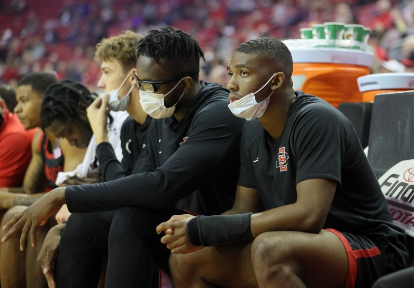 SDSU guard Lamont Butler (right) was a late scratch against UNLV while still recovering from a broken wrist.