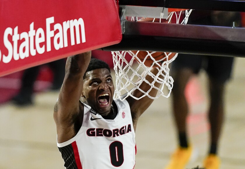 Georgia guard K.D. Johnson dunks during the second half of the team's NCAA college basketball game against Missouri, Tuesday, Feb. 16, 2021, in Athens, Ga. (AP Photo/Brynn Anderson)
