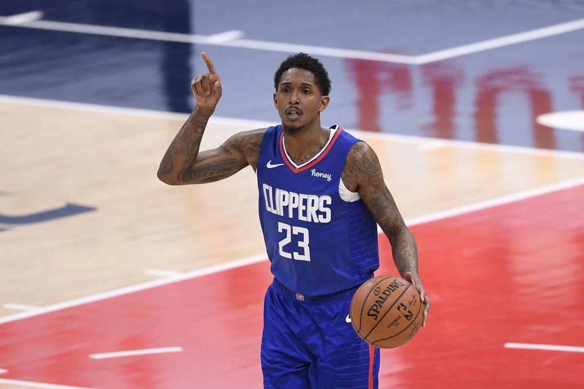 Clippers guard Lou Williams dribbles the ball.