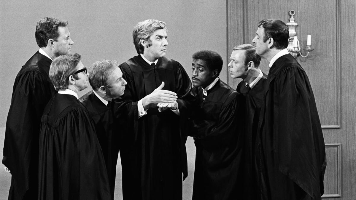 "Rowan & Martin's Laugh-In" cast members Dan Rowan, Arte Johnson, Henry Gibson, Roddy Maude-Roxby, guest Sammy Davis Jr., Larry Hovis and Dick Martin, in a judicial mode.