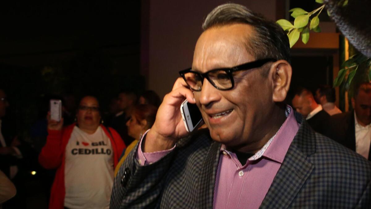 L.A. City Councilman Gil Cedillo is congratulated over the phone during his election night party at the Tree House Lounge in Chinatown on Tuesday night.