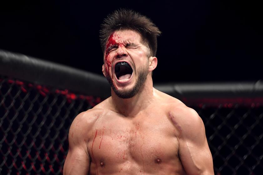 JACKSONVILLE, FLORIDA - MAY 09: Henry Cejudo of the United States celebrates after defeating Dominick Cruz of the United States in their bantamweight title fight during UFC 249 at VyStar Veterans Memorial Arena on May 09, 2020 in Jacksonville, Florida. (Photo by Douglas P. DeFelice/Getty Images)