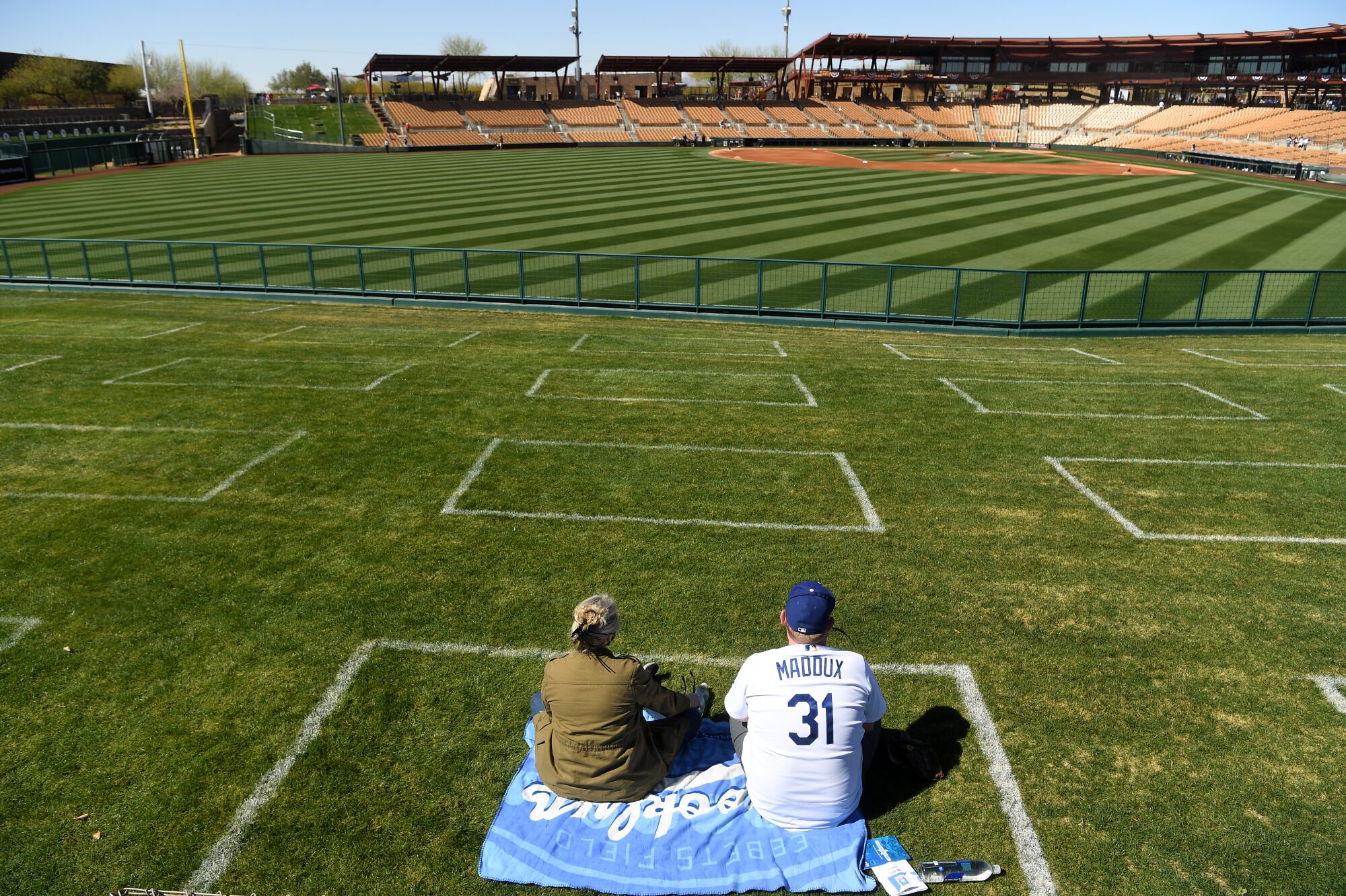 Dodgers fans Lesley Grant and her husband Todd Munson arrive early 