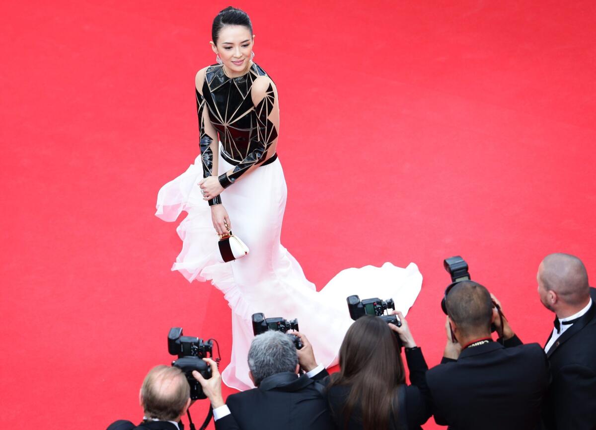 Chinese actress Zhang Ziyi wears a Stephane Rolland Couture gown as she arrives for the screening of "Grace of Monaco" and the opening ceremony of the 67th annual Cannes Film Festival in Cannes, France.
