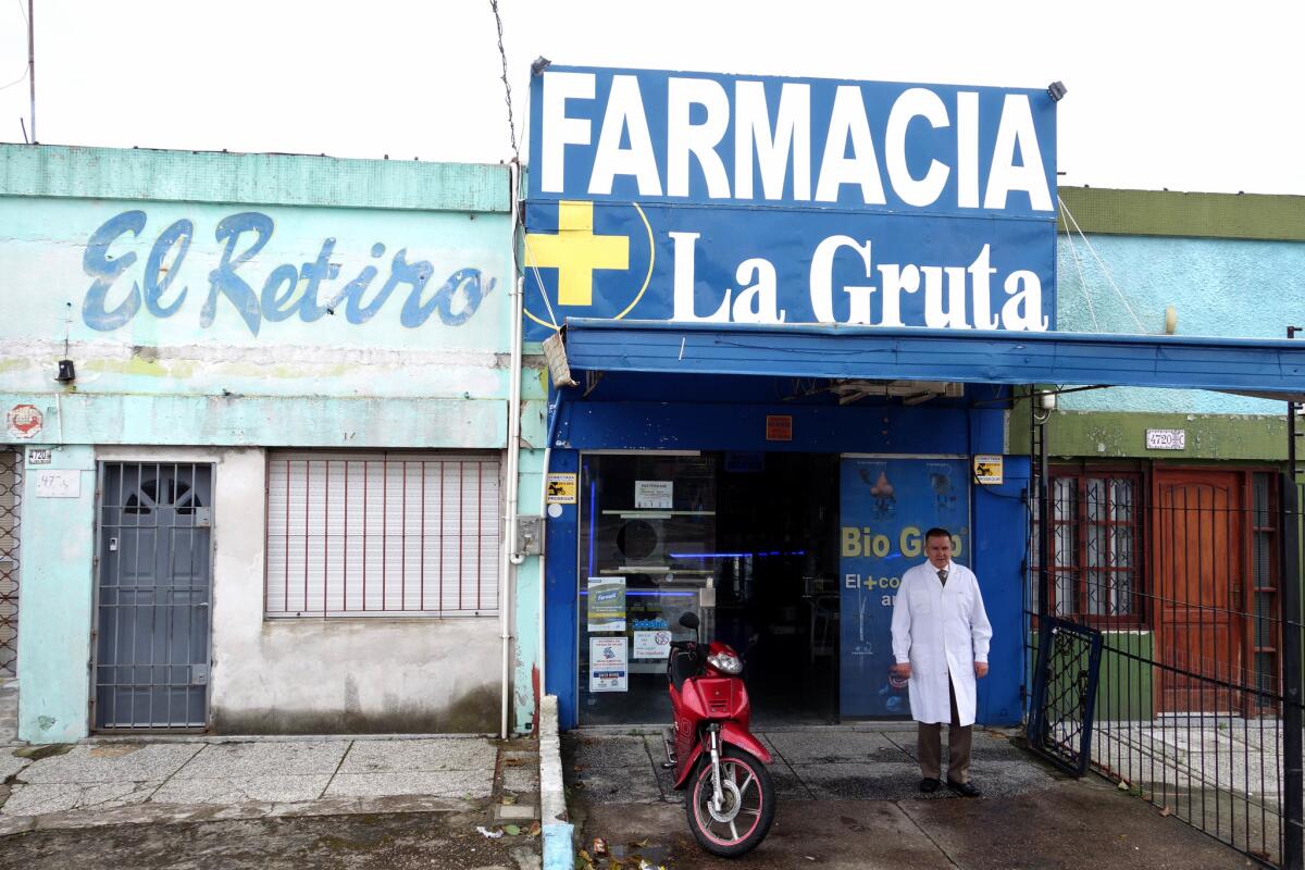 Jorge Suarez, president of Uruguay's Pharmacy Assn., stands in front of his Montevideo pharmacy, from which he will soon be selling small amounts of marijuana to registered users.