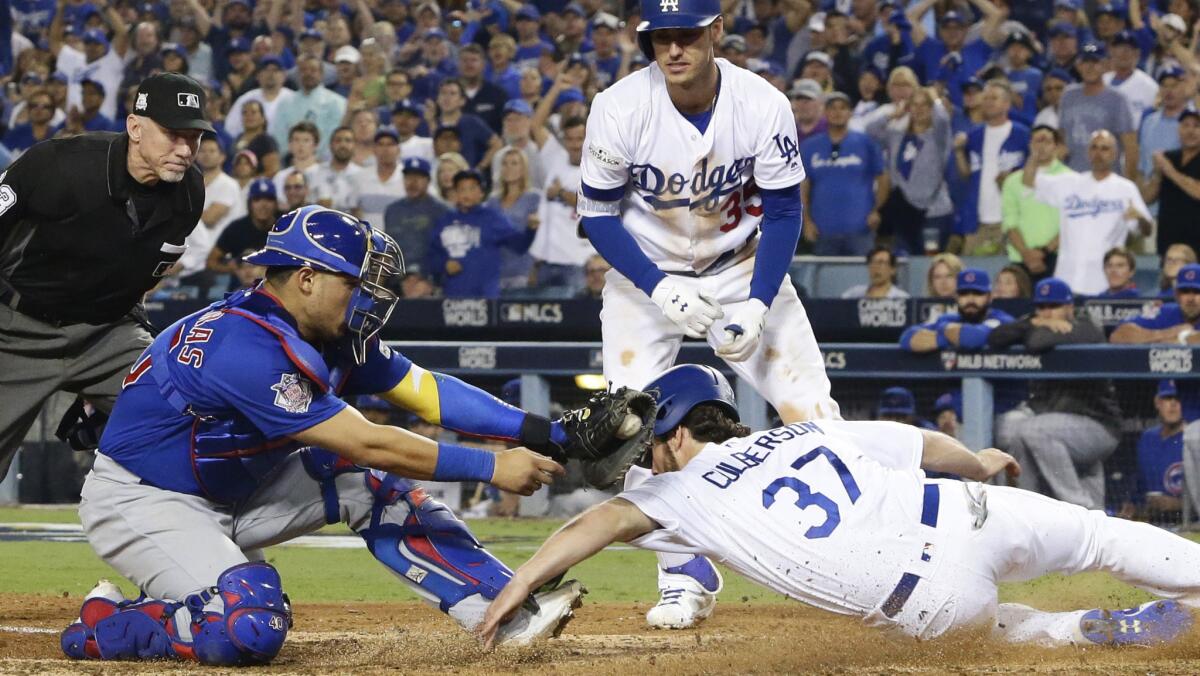 Cubs catcher Willson Contreras tags Dodgers shortstop Charlie Culberson.