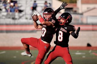 Palos Verdes free safety Niko Tsangaris intercepts a hail mary pass at the 10-yard line to end the first half Friday.