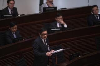 Hong Kong Secretary for Security Chris Tang speaks during the second reading of the Basic Law Article 23 legislation at the Legislative Council in Hong Kong, Tuesday, March 19, 2024. (AP Photo/Louise Delmotte)