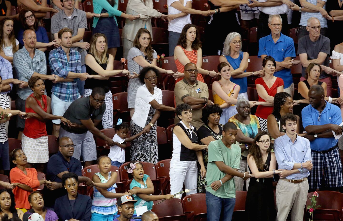 Thousands of people hold hands June 19 and sing"We Shall Overcome" during a prayer vigil for those killed Wednesday night at Emanuel African Methodist Episcopal Church in Charleston, S.C.