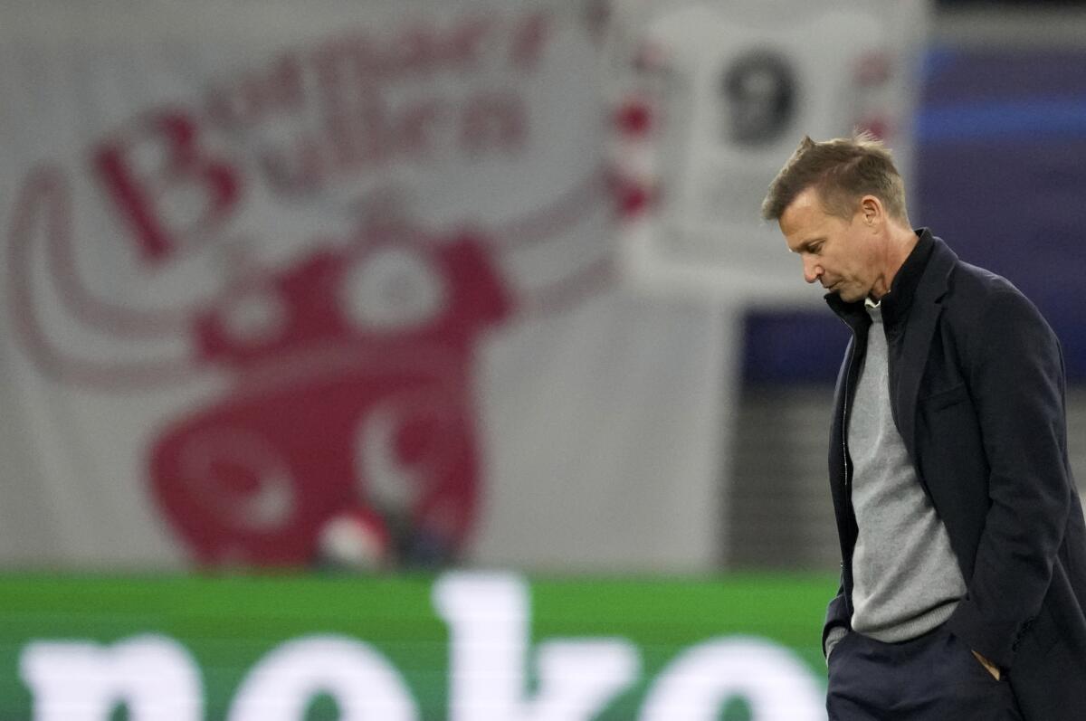 Leipzig's head coach Jesse Marsch leaves the field at the end of the Group A Champion's League soccer match between RB Leipzig and Paris Saint Germain at the Red Bull Arena in Leipzig, Germany, Wednesday, Nov. 3, 2021. (AP Photo/Michael Sohn)