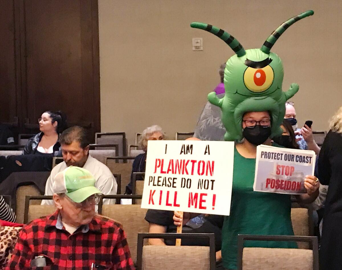 Zoey Lambe-Hommel wears a plankton costume at the California Coastal Commission meeting.