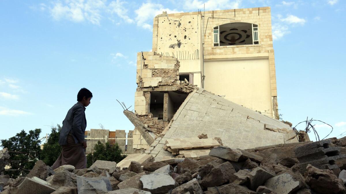 A Yemeni walks through the debris of a destroyed building allegedly targeted by a previous Saudi-led airstrike in Sana'a, Yemen on Nov. 1.