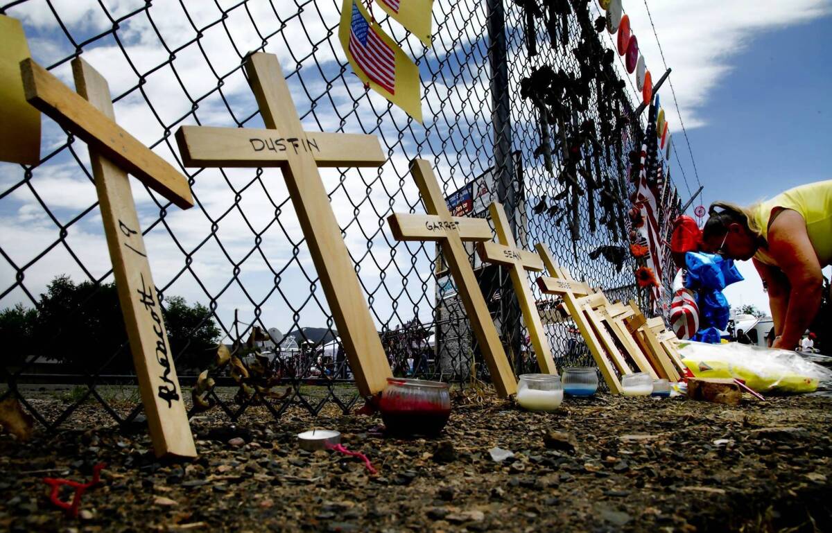 Crosses at a fire station in Prescott, Ariz., honor the lives of the Granite Mountain hotshot team members who were killed in June.