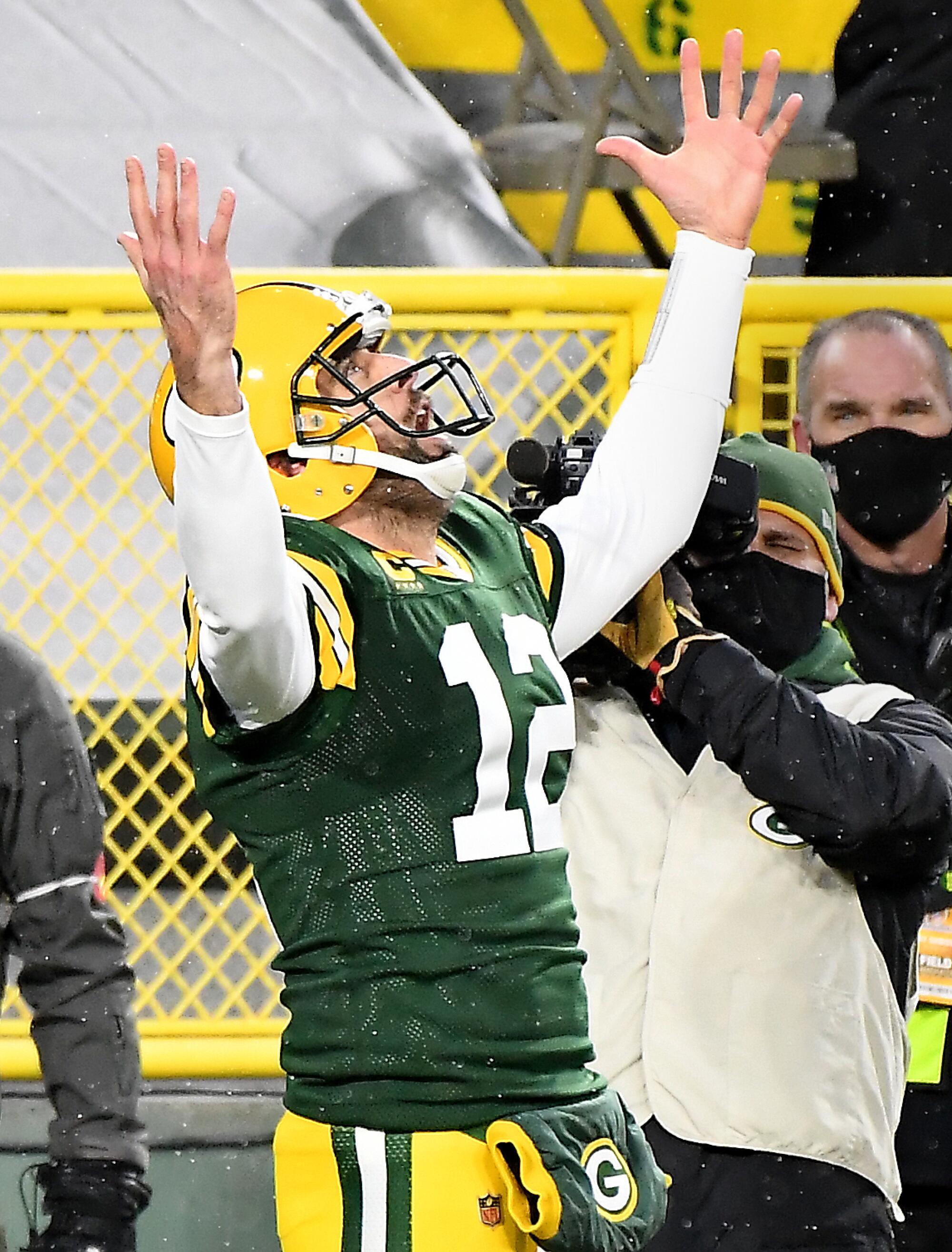 Green Bay Packers quarterback Aaron Rodgers celebrates after scoring a touchdown in the second quarter.