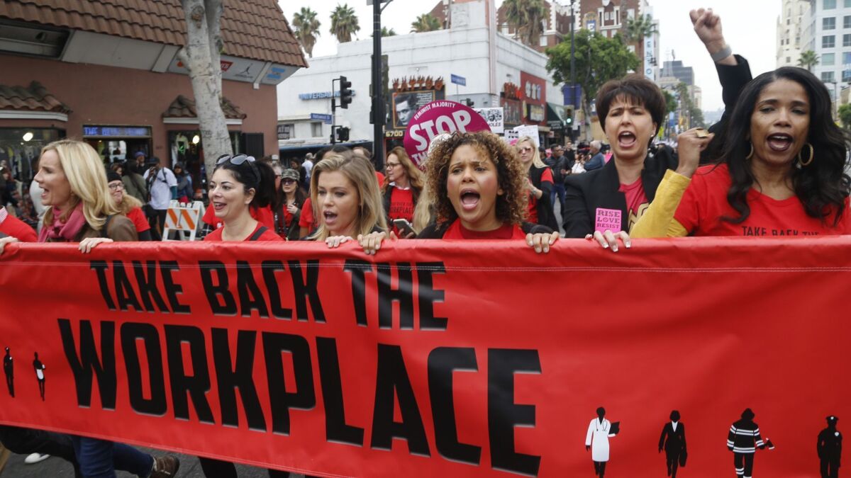 Participants including state Sen. Connie Leyva (D-Chino), second from right, march in Hollywood against sexual assault and harassment in November 2017. Lawmakers took up several bills to crack down on sexual harassment before they adjourned for the year on Aug. 31.