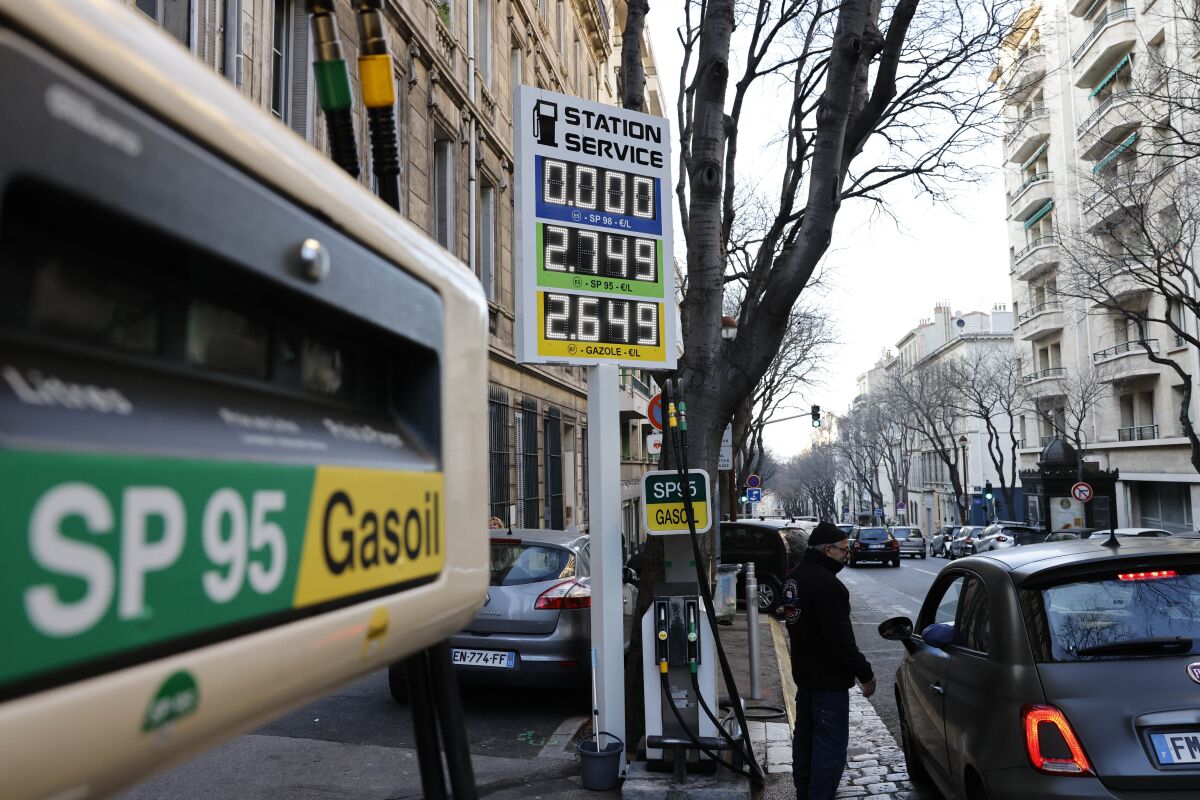 FILE - A car stops in a gas station where prices are up to 2,75 euros per liter (US dlrs. 3.04) in Marseille, southern France, Wednesday, March 9, 2022. The European Union slashed its forecasts of economic growth in the 27-nation bloc amid the prospect of a drawn-out Russian war in Ukraine and disruptions to EU energy trade. EU imports of energy from Russia last year totaled 99 billion euros ($103 billion), or 62% of the bloc's purchases of Russian goods. Russia is the top supplier to the EU of oil, natural gas and coal, accounting for around a quarter of the bloc's total energy. (AP Photo/Jean-Francois Badias, File)