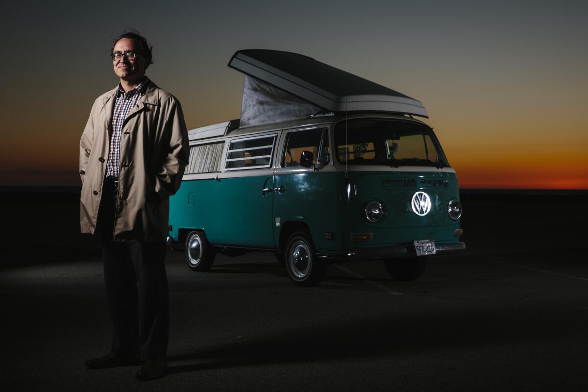 Gustavo Arellano with his Volkswagen Bus at Dockweiler Beach in El Segundo.