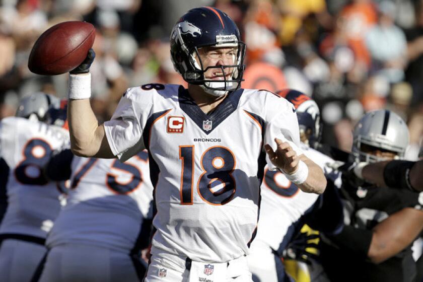 Broncos quarterback Peyton Manning prepares to pass against the Raiders on Sunday in Oakland.