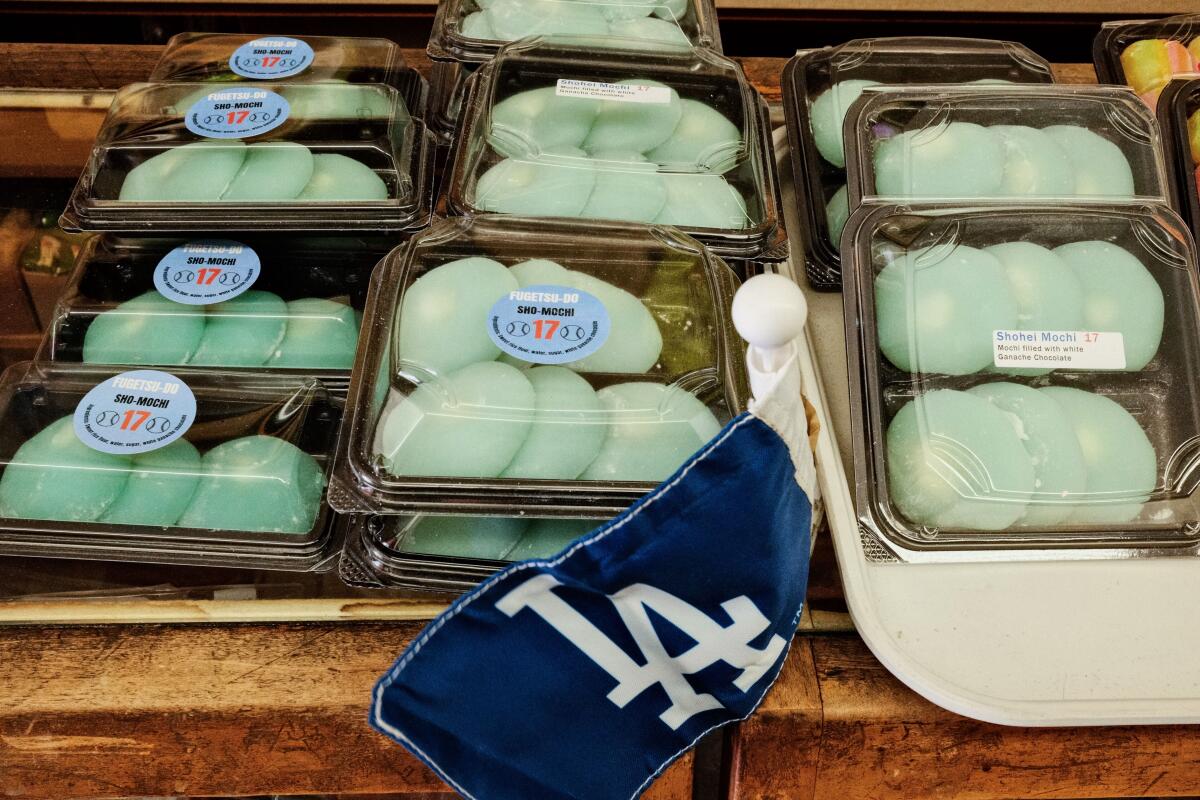 Plastic containers of blue orbs of Shohei Ohtani mochi on a counter in Little Tokyo's Fugetsu-Do