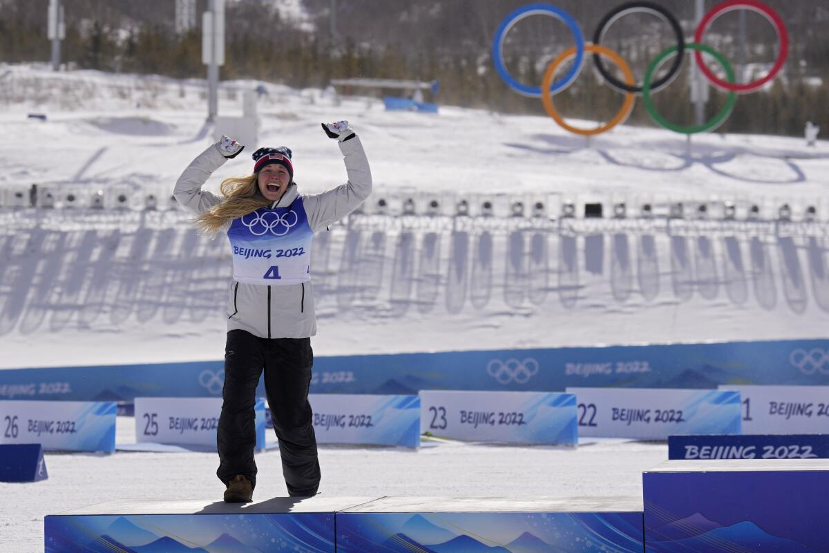 American Jessie Diggins celebrates after earning a silver medal in women's 30-kilometer mass start.