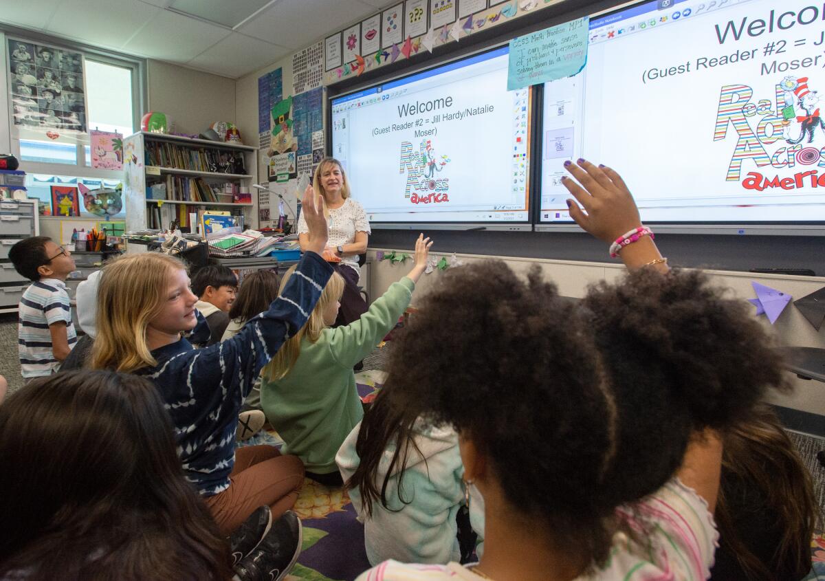 Former Huntington Beach Mayor Jill Hardy takes questions from children.