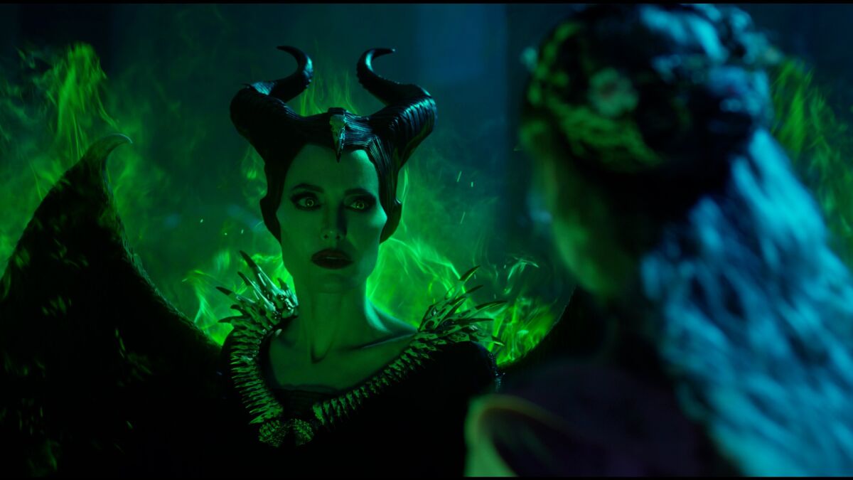 Angelina Jolie, left, as Maleficent and Elle Fanning as Princess Aurora in "Maleficent: Mistress of Evil."