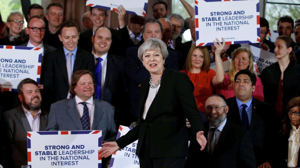 British Prime Minister Theresa May, center, delivers a speech to Conservative Party members as they launch an election campaign in Walmsley Parish Hall in Bolton on April 19, 2017.