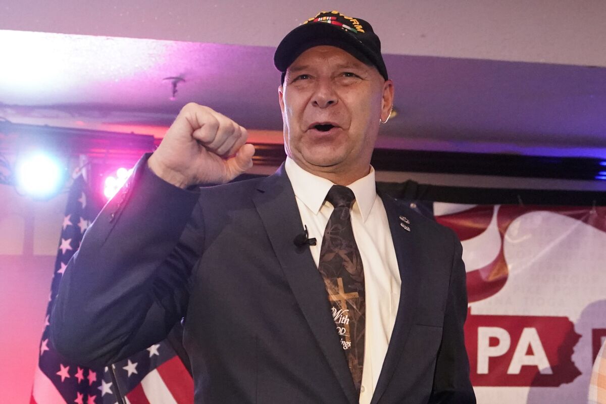 FILE - State Sen. Doug Mastriano, R-Franklin, the Republican candidate for Governor of Pennsylvania, gestures to the cheering crowd during his primary night election party in Chambersburg, Pa., May 17, 2022. Mastriano is perhaps the state's most prominent peddler of former President Donald Trump's lie that widespread fraud cost him the 2020 election. (AP Photo/Carolyn Kaster, File)