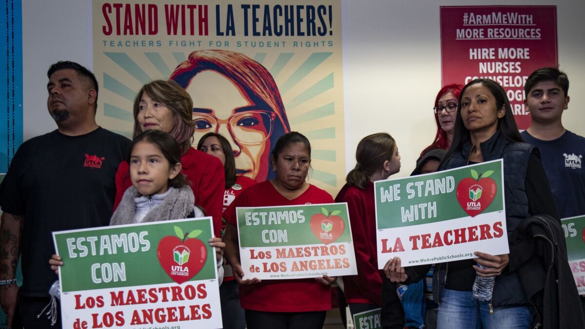Parents, students and educators attend a press conference calling for a cap on charter schools in the Los Angeles Unified School District at UTLA headquarters.