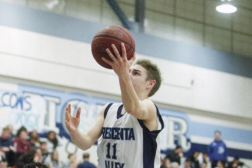 Crescenta Valley's Tyler Carlson drives and shoots against Bakersfield in the first round of the CIF State Division III Southern California Regionals boys' basketball game at Crescenta Valley High School on Tuesday, February 26, 2019.