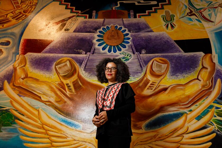 Ana Hernández, the new executive director of Centro Cultural de la Raza, poses at the organization’s building at Balboa Park on Thursday, March 28, 2024.