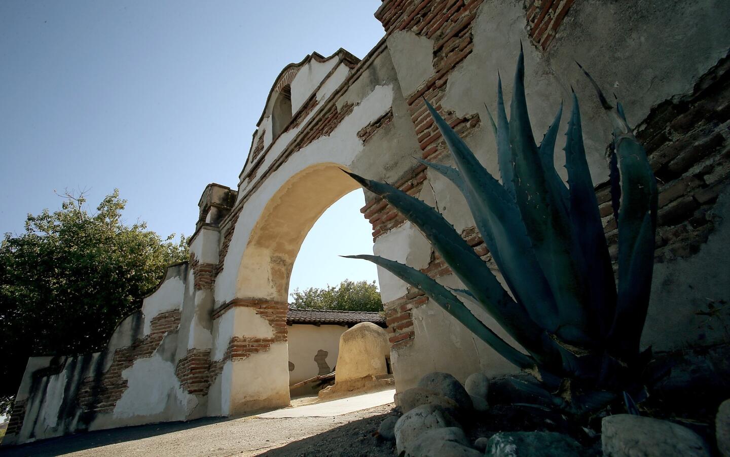 A brick and mortar arch serves as the entrance to Mission San Miguel Arcángel. Established on July 25, 1797, by Franciscan monks, the site was chosen for its proximity to large numbers of native Salinan Indians, whom the Spanish priests wanted to evangelize.