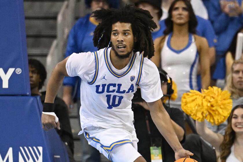 UCLA guard Tyger Campbell brings the ball up the floor while playing Oregon during the second half.