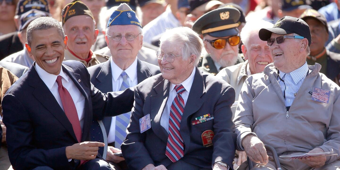 President Obama greets WWII veterans at the Normandy American Cemetery on the 70th anniversary of D-Day.