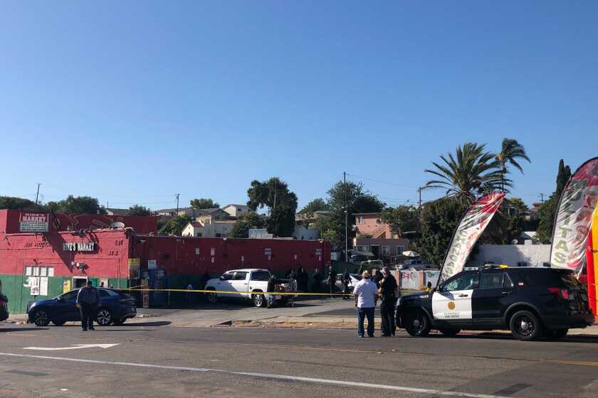 San Diego police investigate after 2 people were shot, one fatally, Monday afternoon outside Mike's Market in Mountain View.