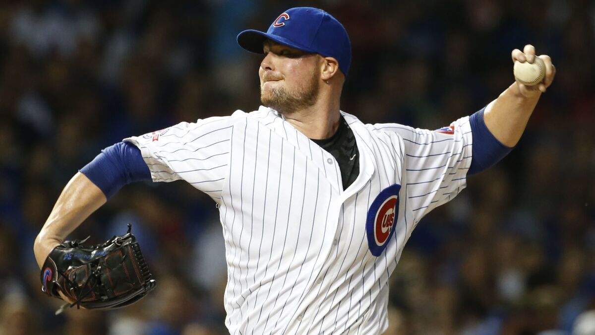 Cubs starter Jon Lester delivers a pitch against the Cardinals on Sept. 25, 2016.