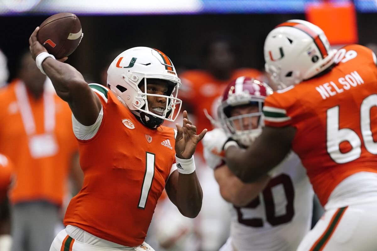 Miami quarterback D'Eriq King (1) throws from the pocket during the first half of an NCAA college football game against Alabama, Saturday, Sept. 4, 2021, in Atlanta. (AP Photo/John Bazemore)