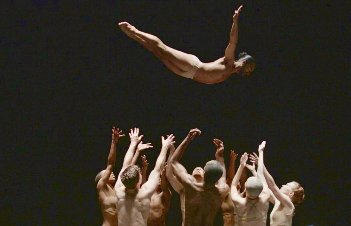 Dancers toss another dancer in the air in the documentary “Can You Bring It: Bill T. Jones and D-Man in the Waters.”