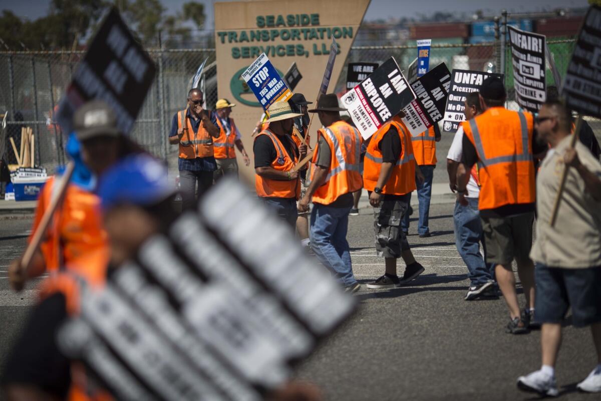 Striking port truck drivers voted late Friday to return to work, ending their labor action