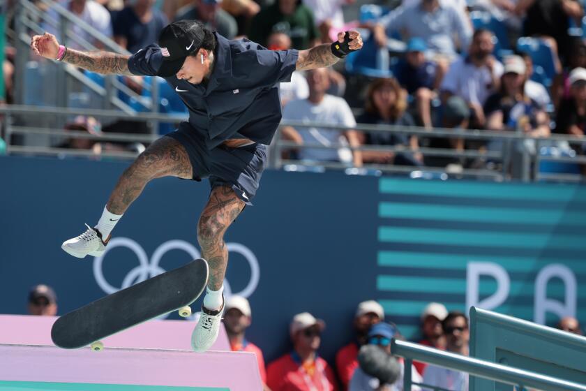 PARIS, FRANCE July 29, 2024-USA's Nyjah Huston completes a trick in the finals of the Men's street skateboard competition at the 2024 Olympics in Paris, France Monday. Eaton won the silver medal. (Wally Skalij/Los Angeles Times)