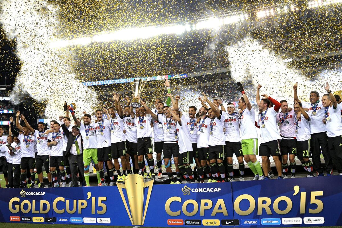 Team Mexico celebrates after defeating Jamaica, 3-1, in the CONCACAF Gold Cup final in Philadelphia on July 26.