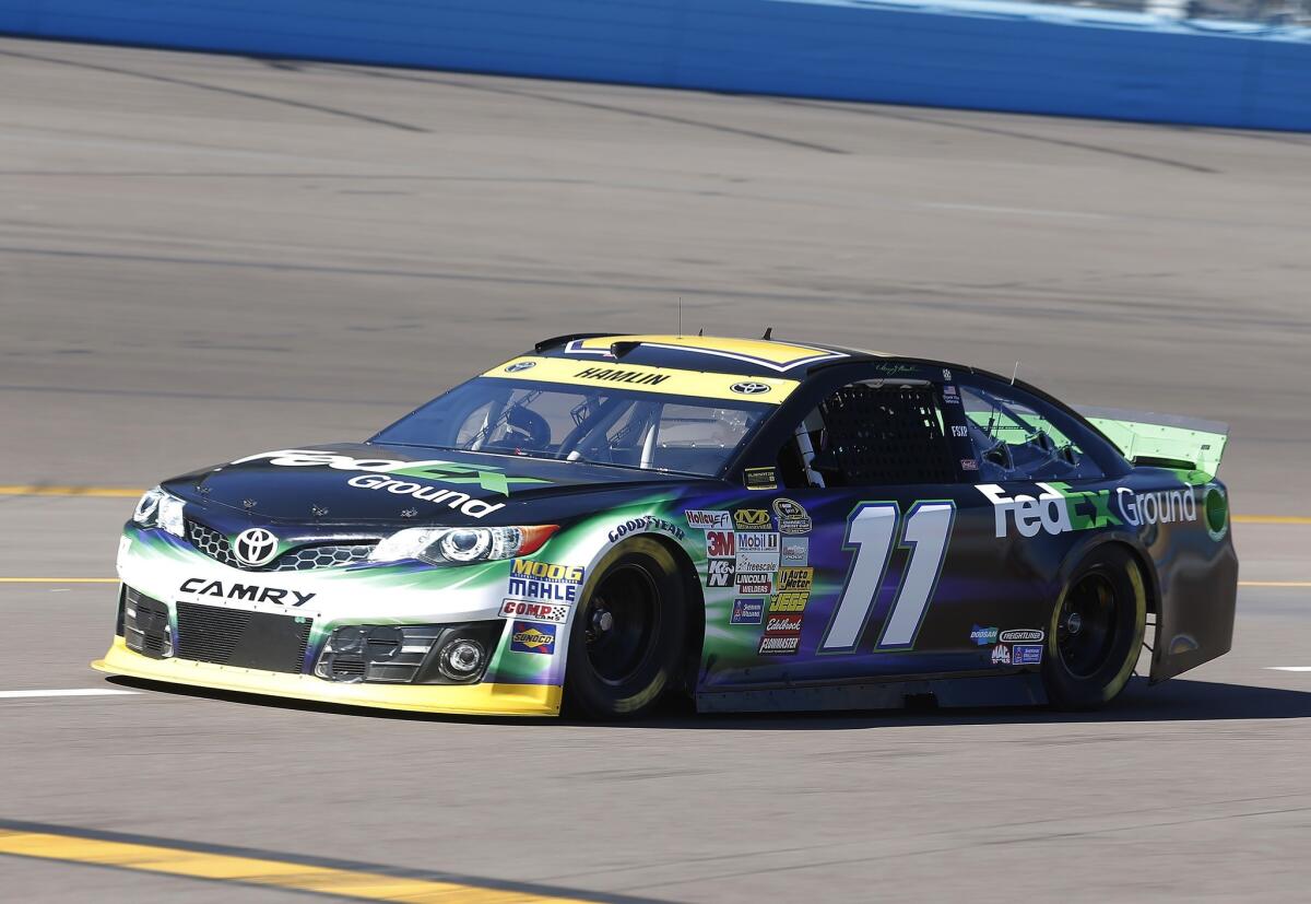 Denny Hamlin, one of eight drivers left in NASCAR's Chase title playoff, grabbed pole position at Phoenix International Raceway for Sunday's race with a lap of 142.113 mph.