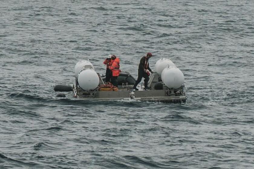 In this photo released by Action Aviation, the submersible Titan is prepared for a dive into a remote area of the Atlantic Ocean on an expedition to the Titanic on Sunday, June 18, 2023. Rescuers raced against time Tuesday, June 20, to find the missing submersible carrying five people, who were reported overdue Sunday night. (Action Aviation via AP)