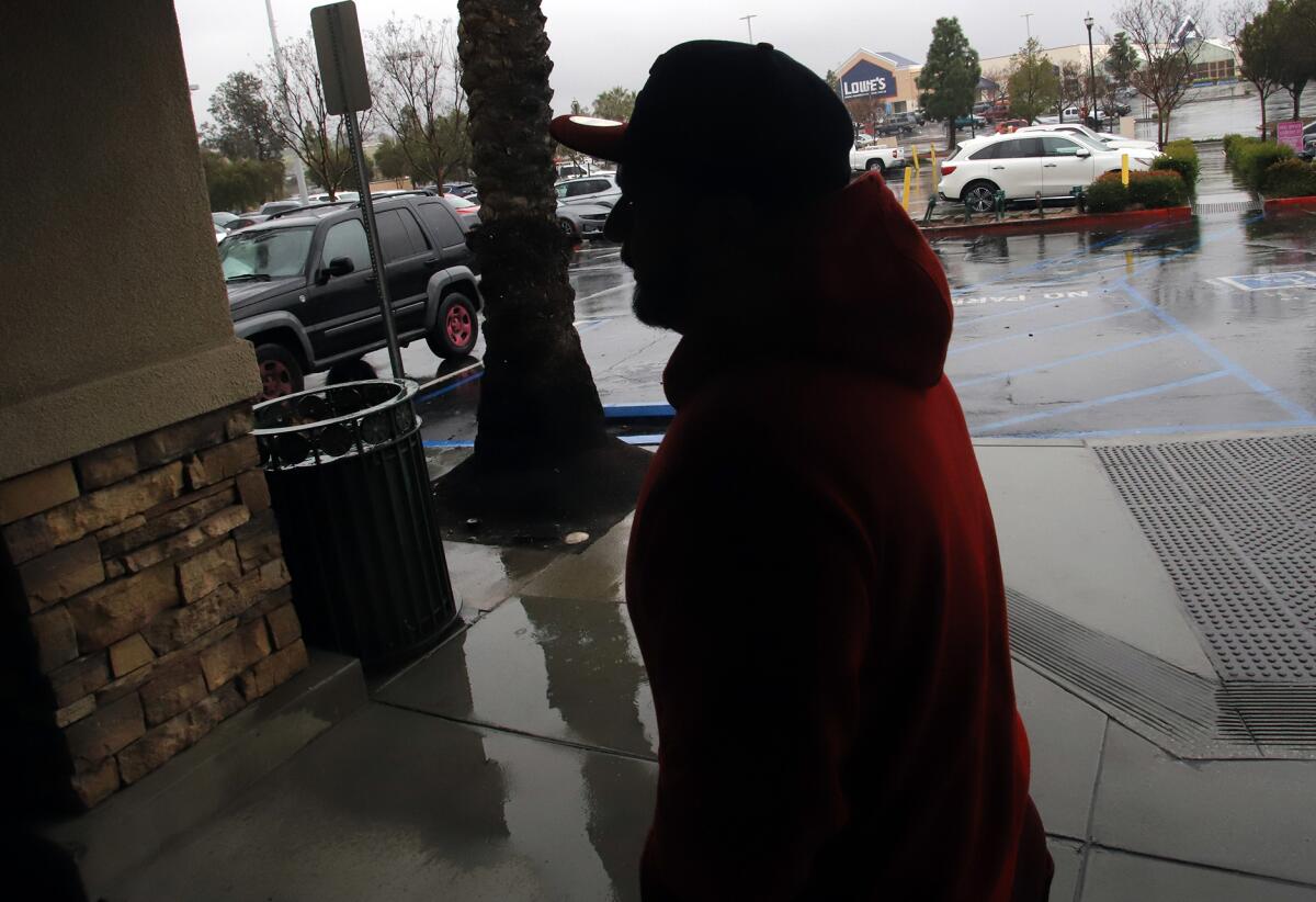 Cesar Hernández gazes out the window of a cafe in Moreno Valley. He is part of a class action suit against GEO Group