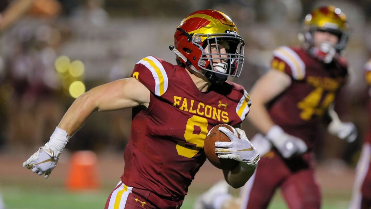Torrey Pines running back Mac Bingham (shown in an earlier game) scored a San Diego Section-record eight touchdowns in Friday's win over Oceanside.